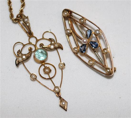 An Edwardian gold pendant on chain and a brooch.